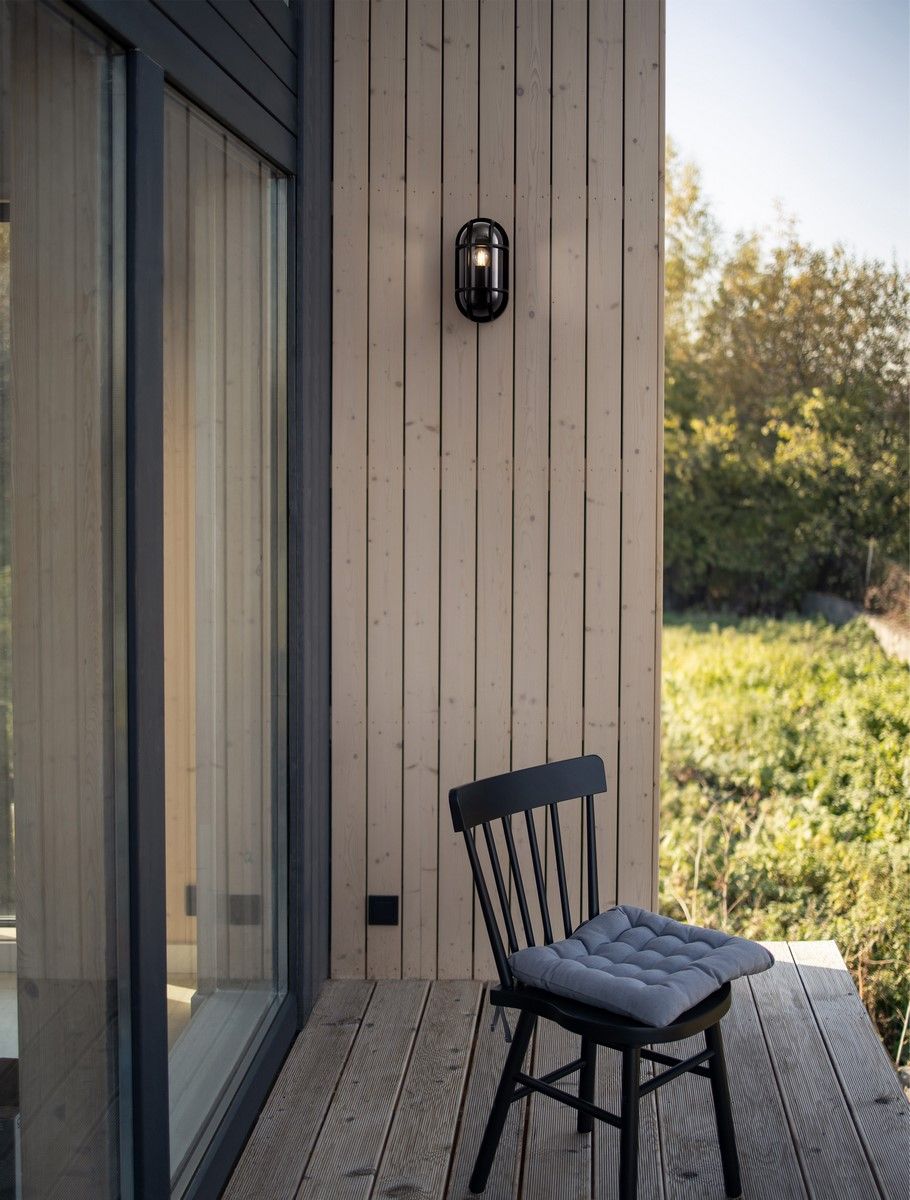 Barnhouse, Barn house. Wooden secluded house in the Scandinavian and Finland modern style with large windows. Exterior, wooden walls, terrace, forest view